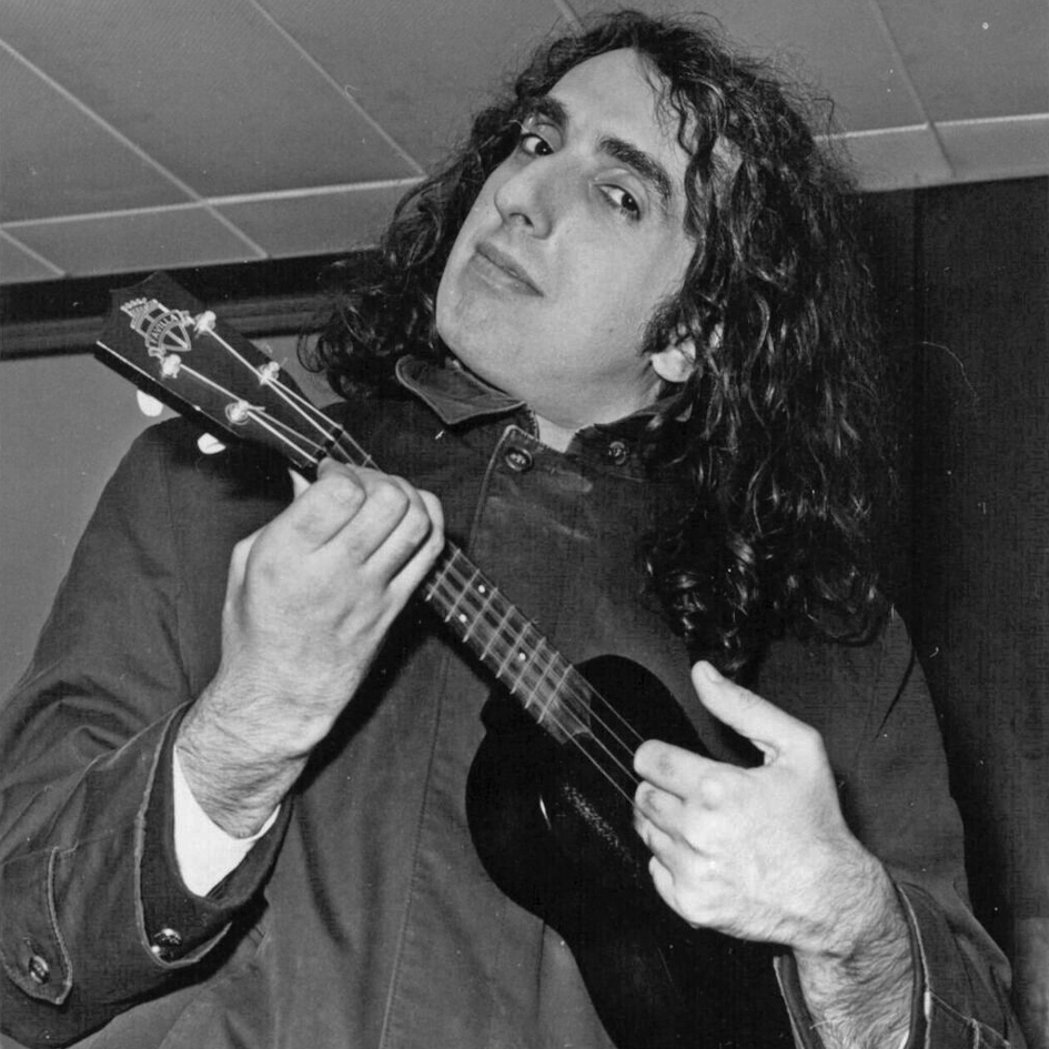 American singer and musician Tiny Tim playing his ukulele in a publicity photograph taken in 1969.